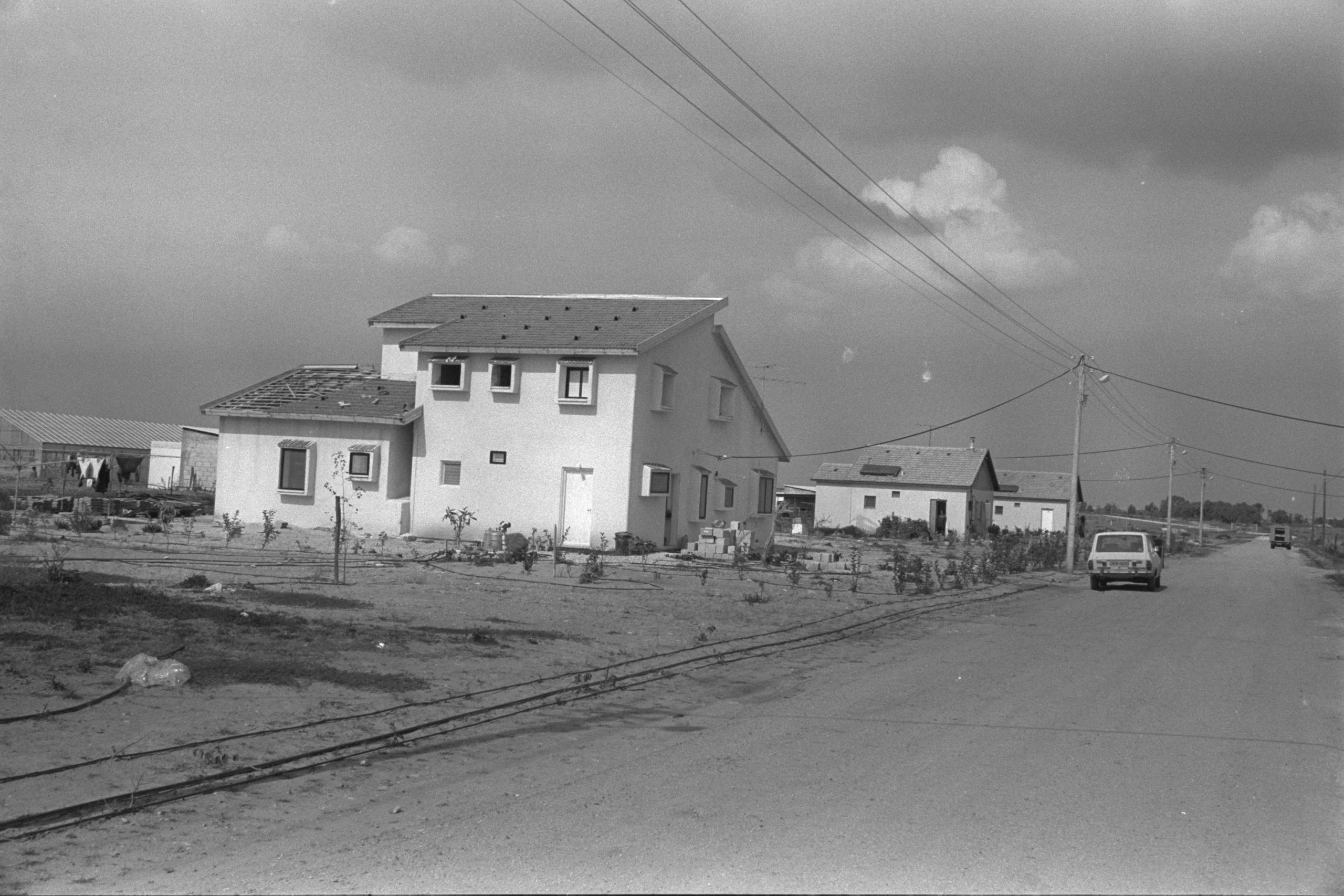 Two-story house of a pioneer with a large family at moshav Pri Gan (Goldstein Gil, Israel's National Photo Collection)