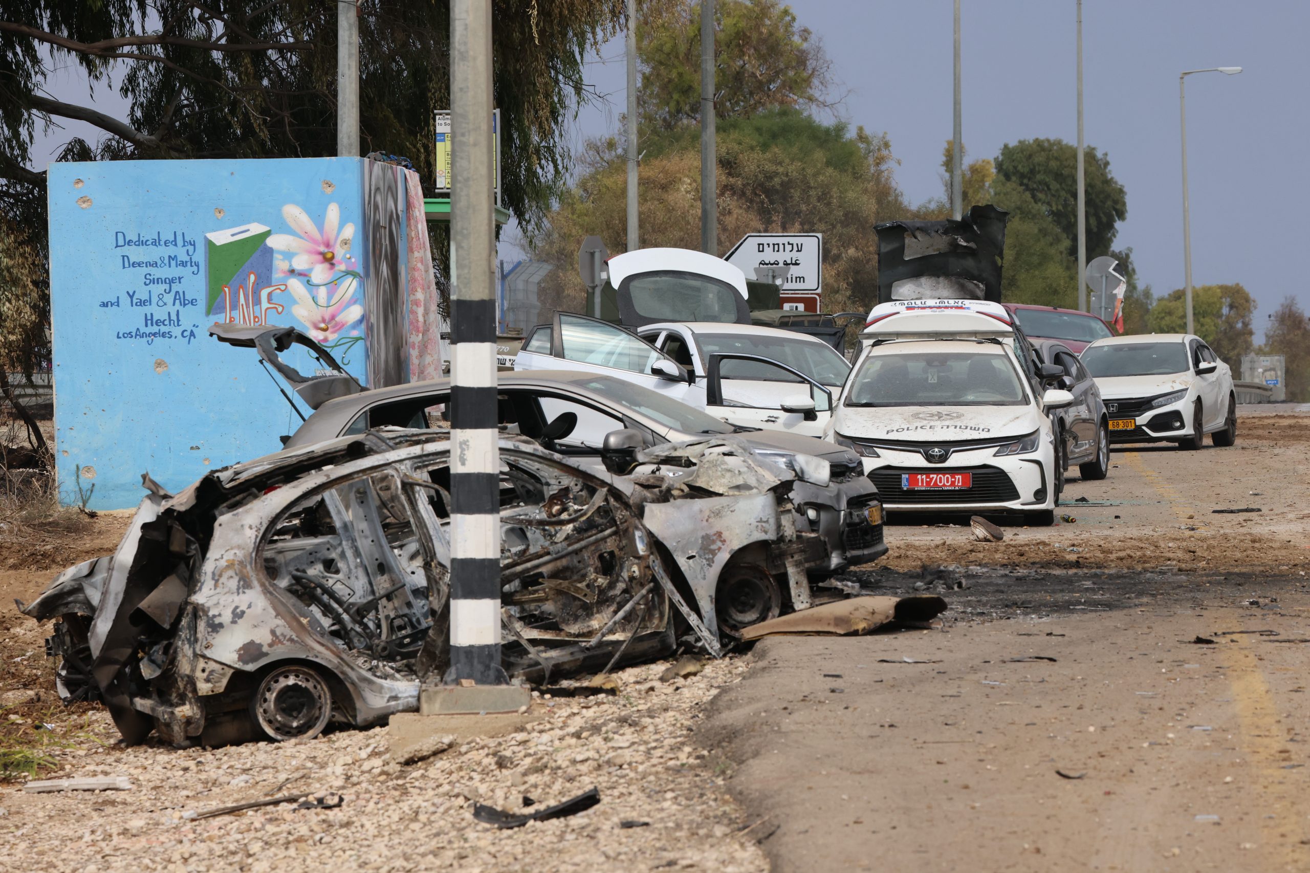 Ruined cars by the side of the road outside Kerem Sahlom (Yossi Zamir, KKL-JNF Photo Archive)